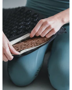 Linen acupressure mat with neck pillow and pressure point discs for targeted support.