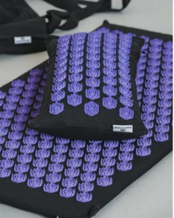 Classic linen acupressure mat and pillow with pressure point discs for back and neck relief.