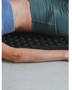Linen acupressure mat with neck pillow and pressure point discs for targeted support.